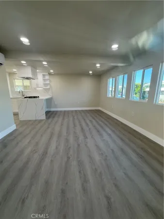 a kitchen with cabinets and window