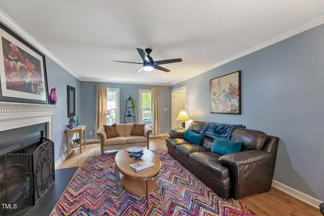 a living room with furniture and a fireplace