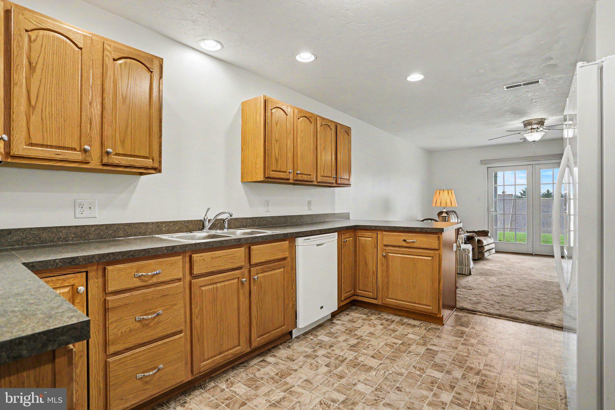 1371 Chami Drive, Unit 166 Spring Grove, PA 17362 - Photo 14 of 28 a kitchen with stainless steel appliances granite countertop a sink and cabinets