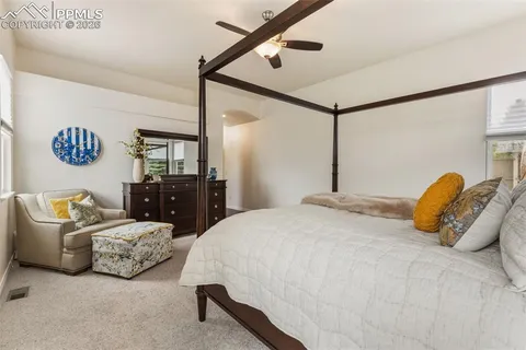 a bedroom with bed and window