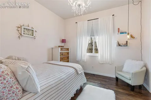 a bedroom with a bed and a couch