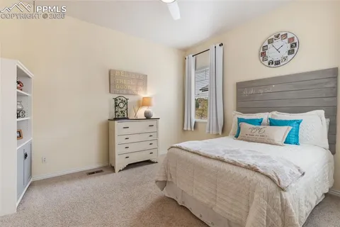 a bedroom with a bed and cabinets