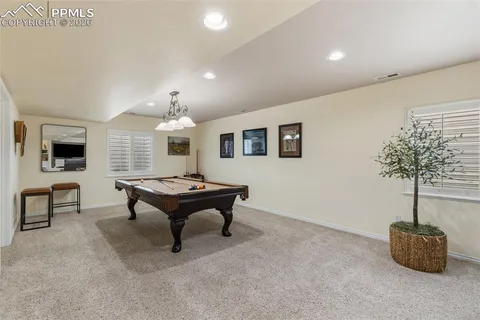 a room with furniture and a potted plant