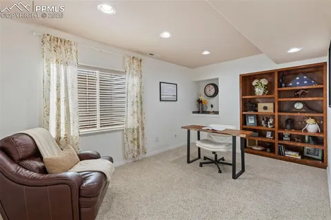 a work room with furniture and window