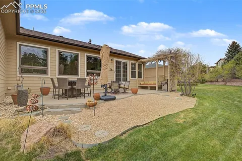 a view of house with yard