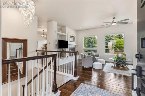 a view of a living room and a window with furniture