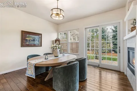 a view of a dining room with furniture window and wooden floor