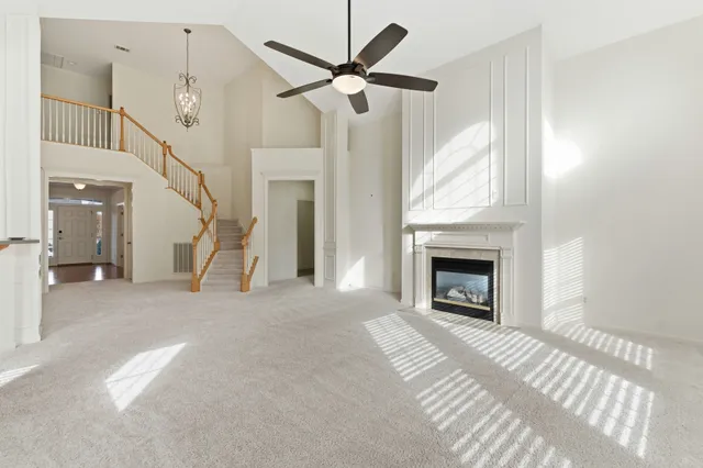 a kitchen with a stove a sink a dining table and chairs