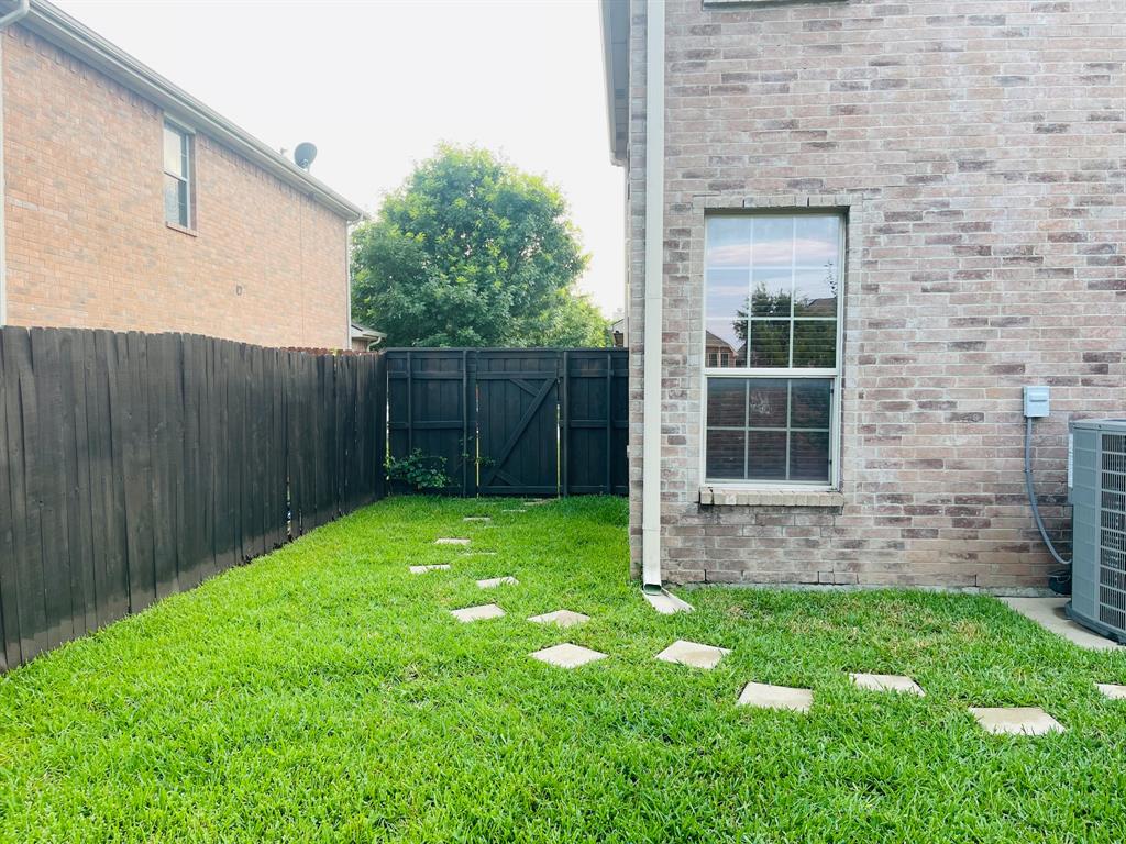 516 Angela Lane Euless, TX 76039 - Photo 33 of 39 View of yard with a gate