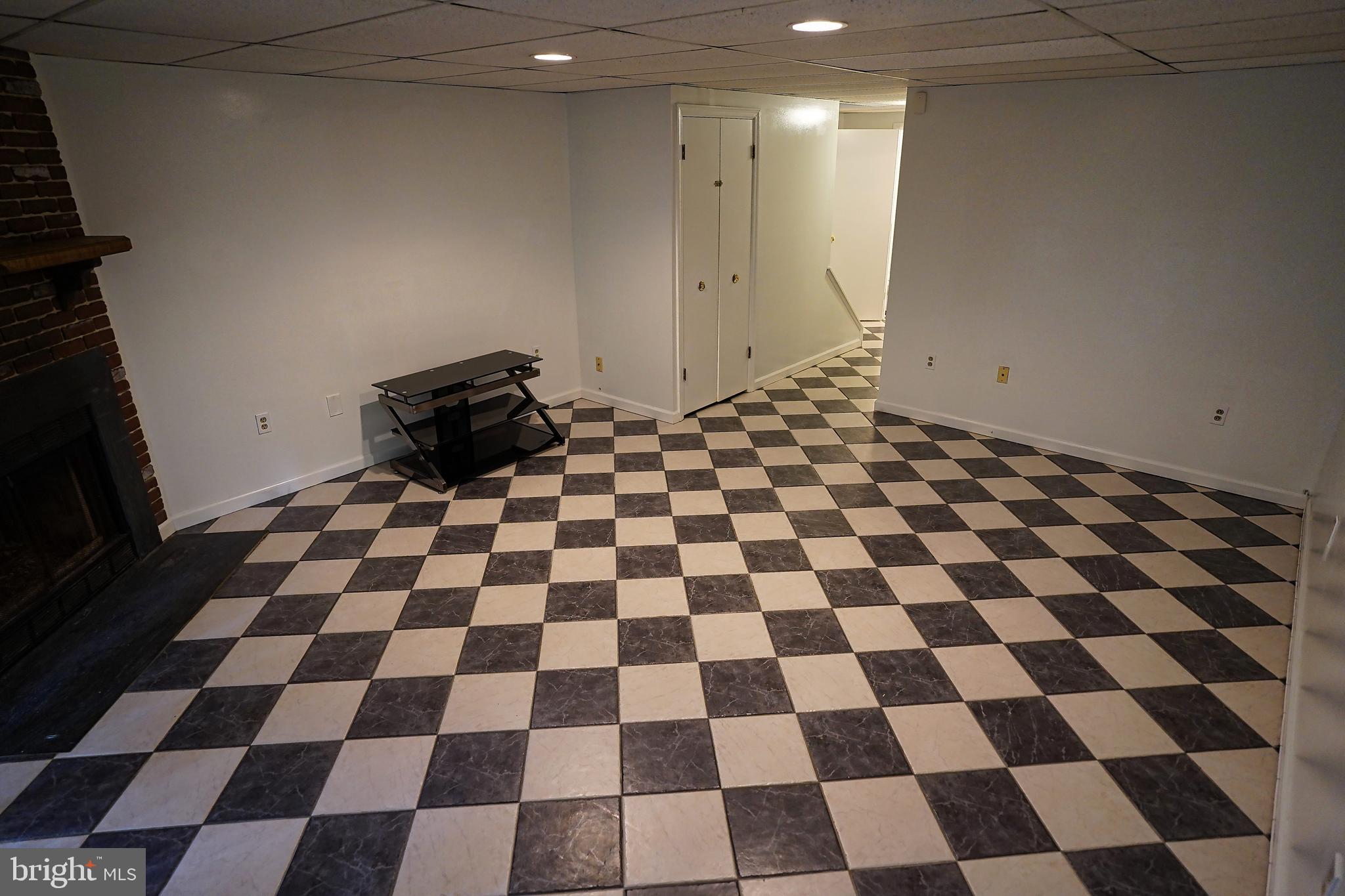 6948 Rockfield Road Baltimore, MD 21244 - Photo 21 of 47 a black and white checkered floor