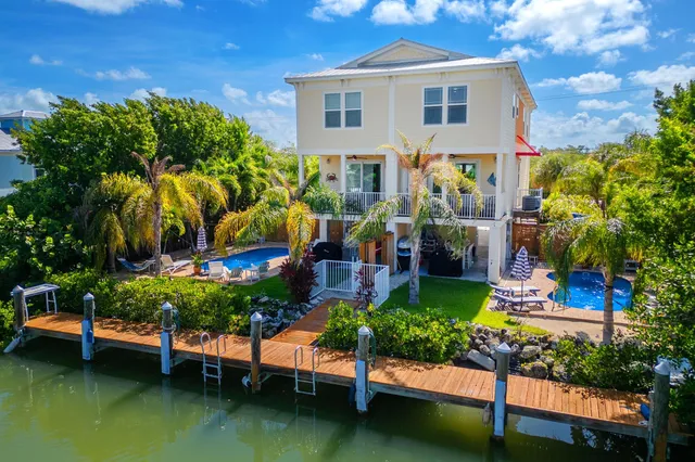 a balcony with furniture and a potted plant