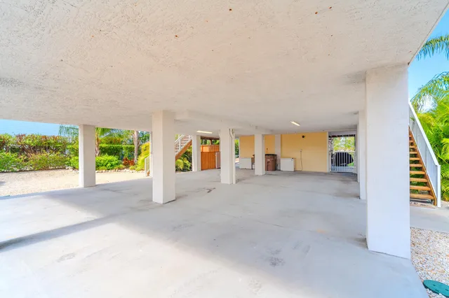 a kitchen with granite countertop cabinets stainless steel appliances and a sink