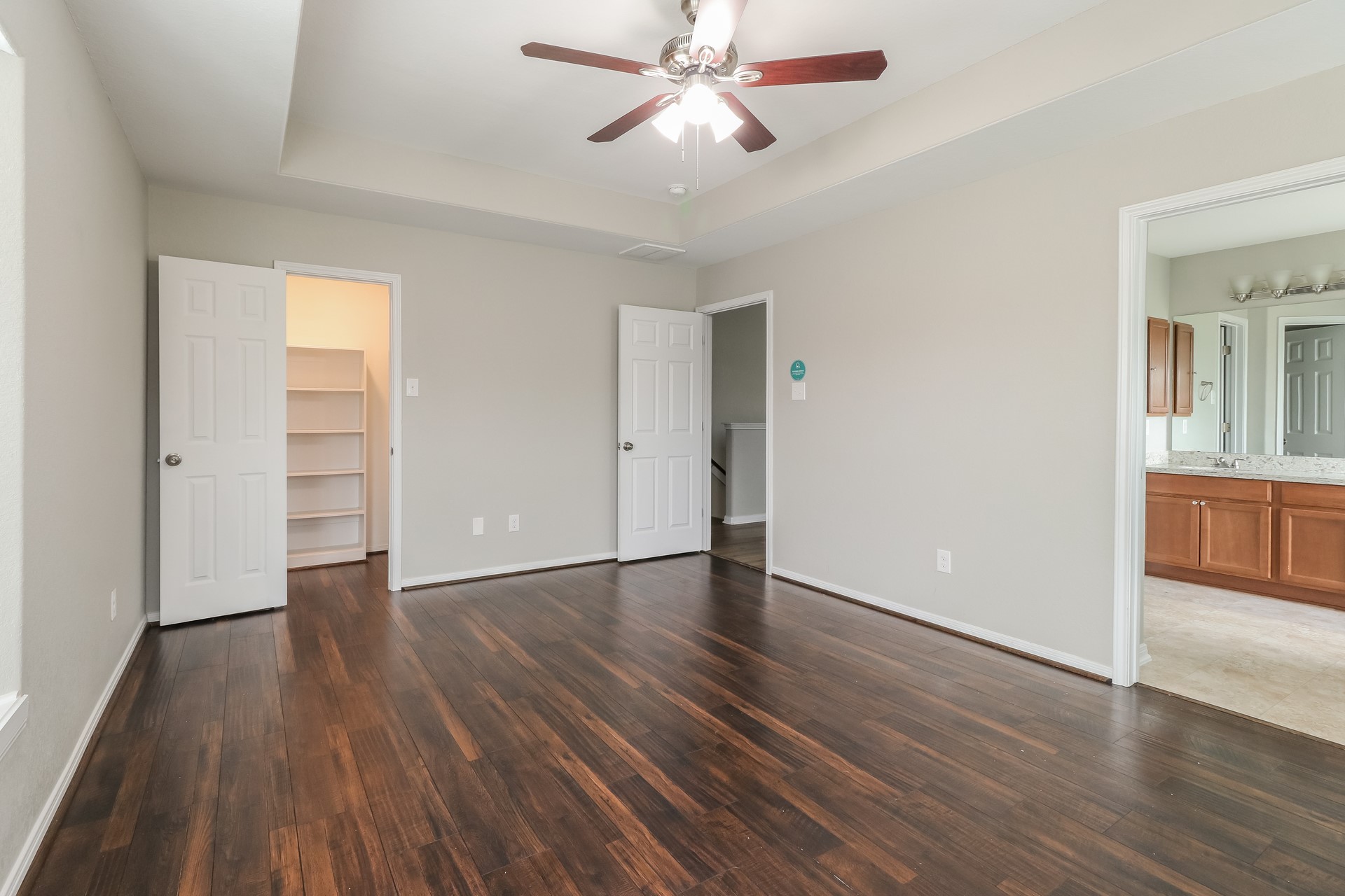 29331 Indian Clearing Spring, TX 77386 - Photo 12 of 17 wooden floor in an empty room with a window