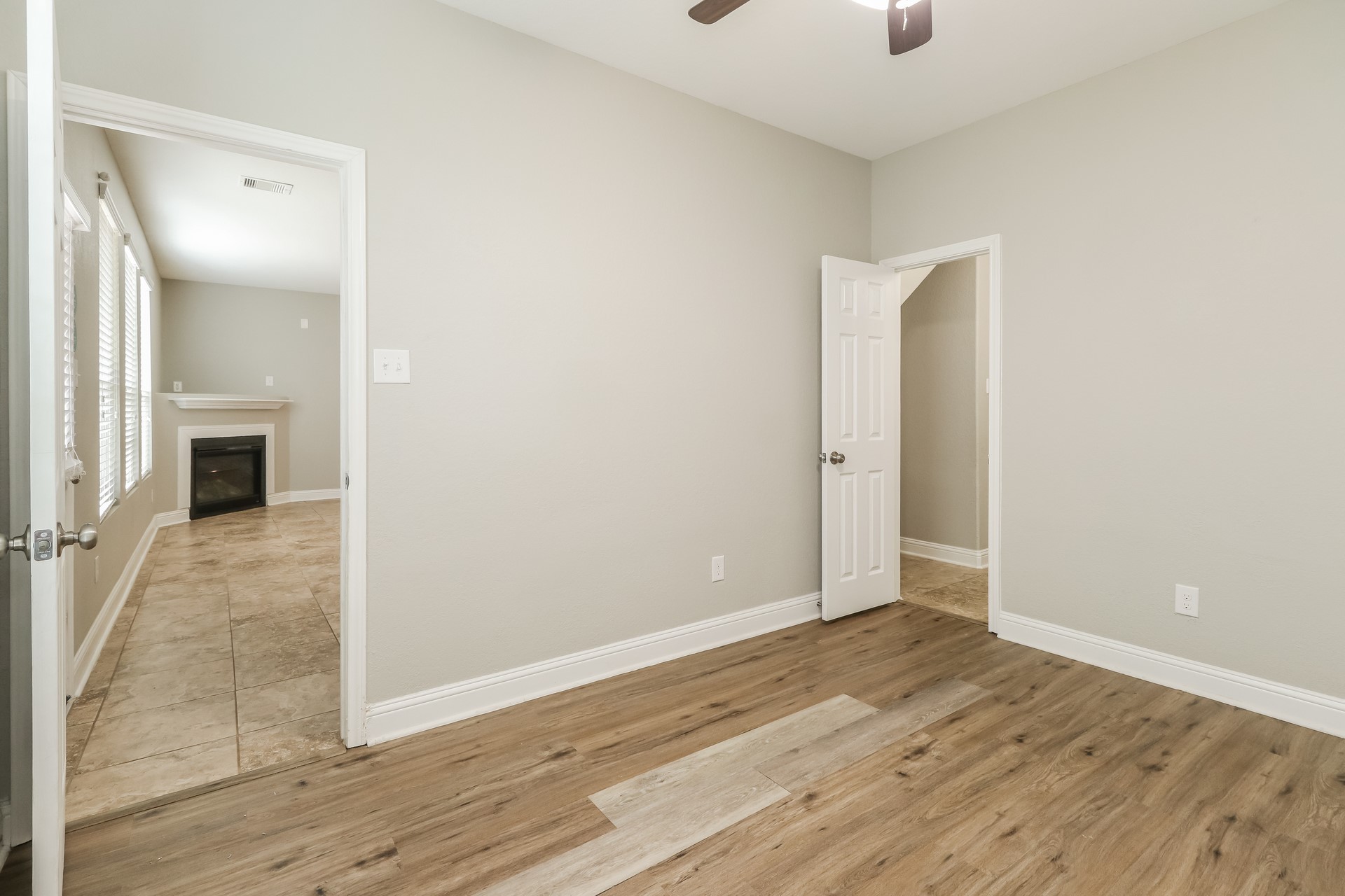 29331 Indian Clearing Spring, TX 77386 - Photo 14 of 17 an empty room with wooden floor and windows