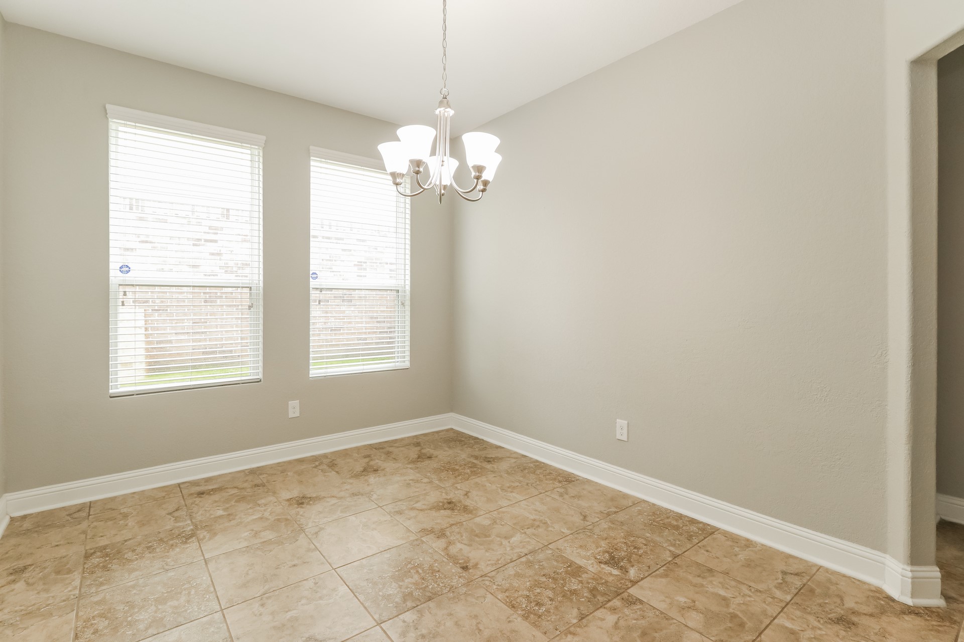 29331 Indian Clearing Spring, TX 77386 - Photo 7 of 17 a view of a windows and chandelier in a room