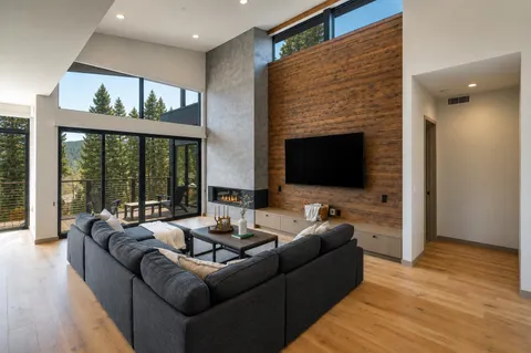 a living room with furniture fireplace and a flat screen tv