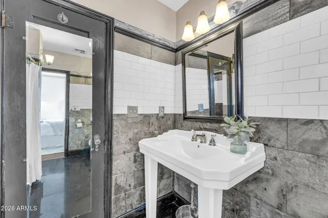 a bathroom with a sink and a mirror