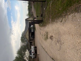a view of a car park on the side of a road