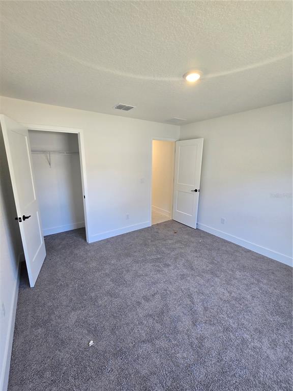 2525 Clearwood Street Inverness, FL 34452 - Photo 11 of 17 an empty room with white walls and white door