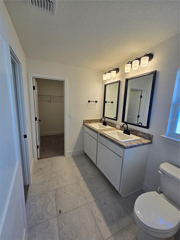 2525 Clearwood Street Inverness, FL 34452 - Photo 15 of 17 a bathroom with a toilet sink and mirror