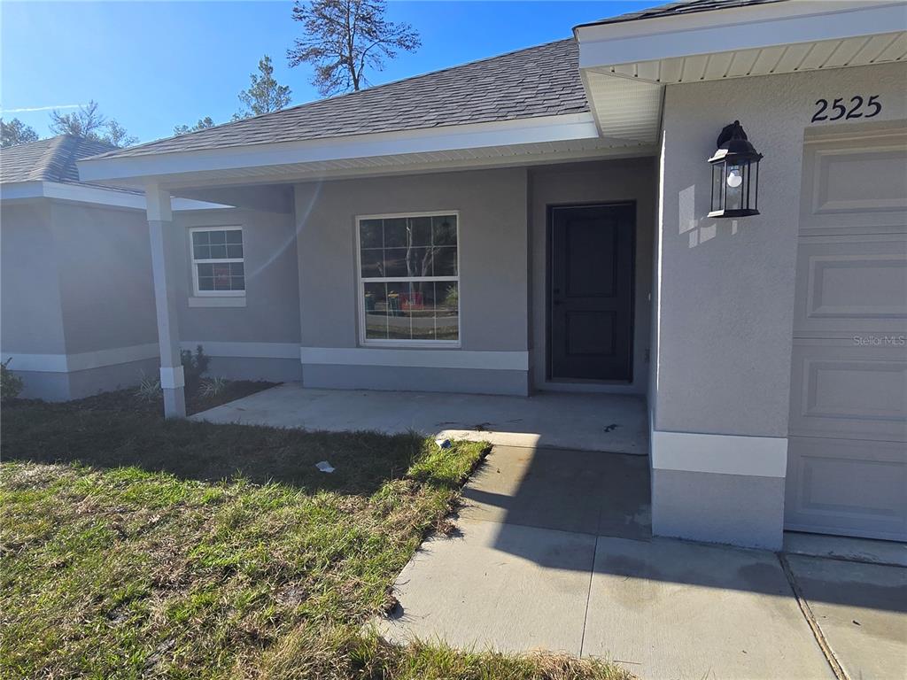 2525 Clearwood Street Inverness, FL 34452 - Photo 2 of 17 a view of a house with a yard