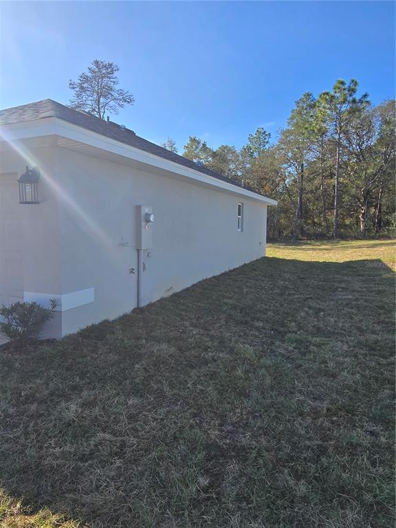 2525 Clearwood Street Inverness, FL 34452 - Photo 3 of 17 a view of a big yard with an outdoor space