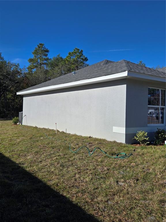 2525 Clearwood Street Inverness, FL 34452 - Photo 4 of 17 a view of a big yard next to a yard