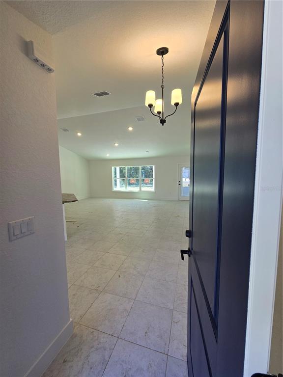 2525 Clearwood Street Inverness, FL 34452 - Photo 6 of 17 an empty room with a mirror