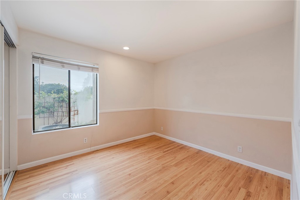 263 Tarocco Irvine, CA 92618 - Photo 14 of 34 an empty room with wooden floor and windows