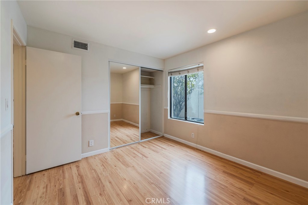 263 Tarocco Irvine, CA 92618 - Photo 15 of 34 a view of an empty room with wooden floor and a window