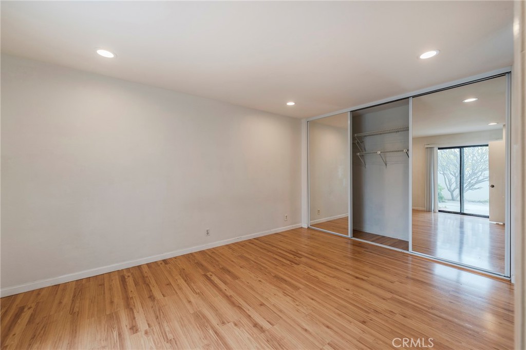 263 Tarocco Irvine, CA 92618 - Photo 17 of 34 a view of an empty room with wooden floor and a window
