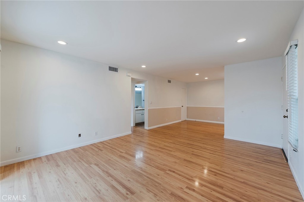 263 Tarocco Irvine, CA 92618 - Photo 4 of 34 a view of an empty room with wooden floor