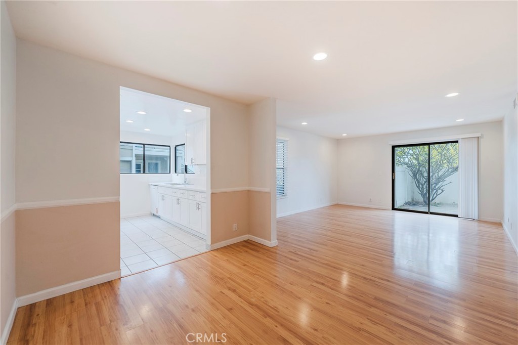 263 Tarocco Irvine, CA 92618 - Photo 7 of 34 a view of empty room with wooden floor and windows