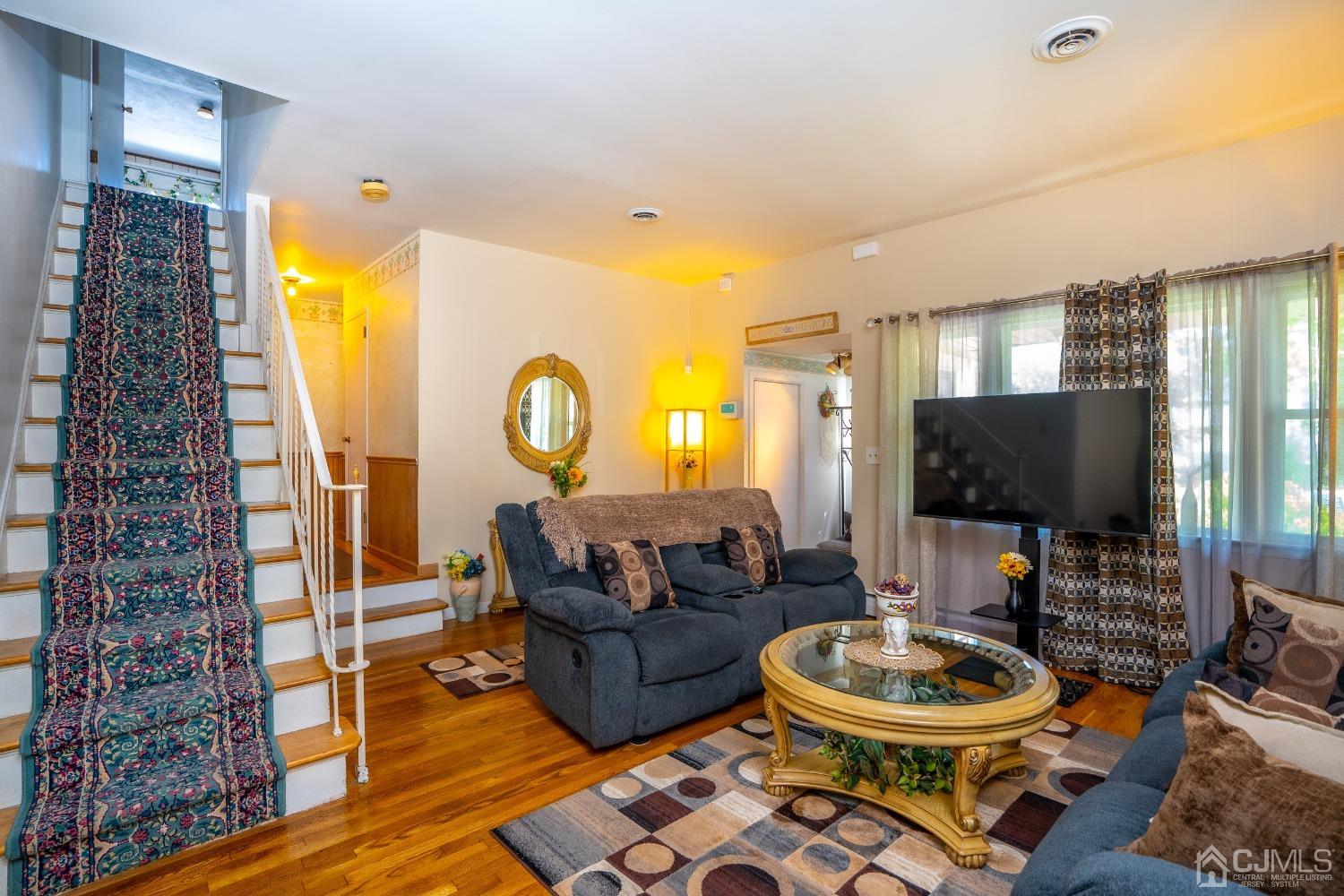 11 Exeter Road Fords, NJ 08863 - Photo 5 of 29 a living room with furniture and a flat screen tv