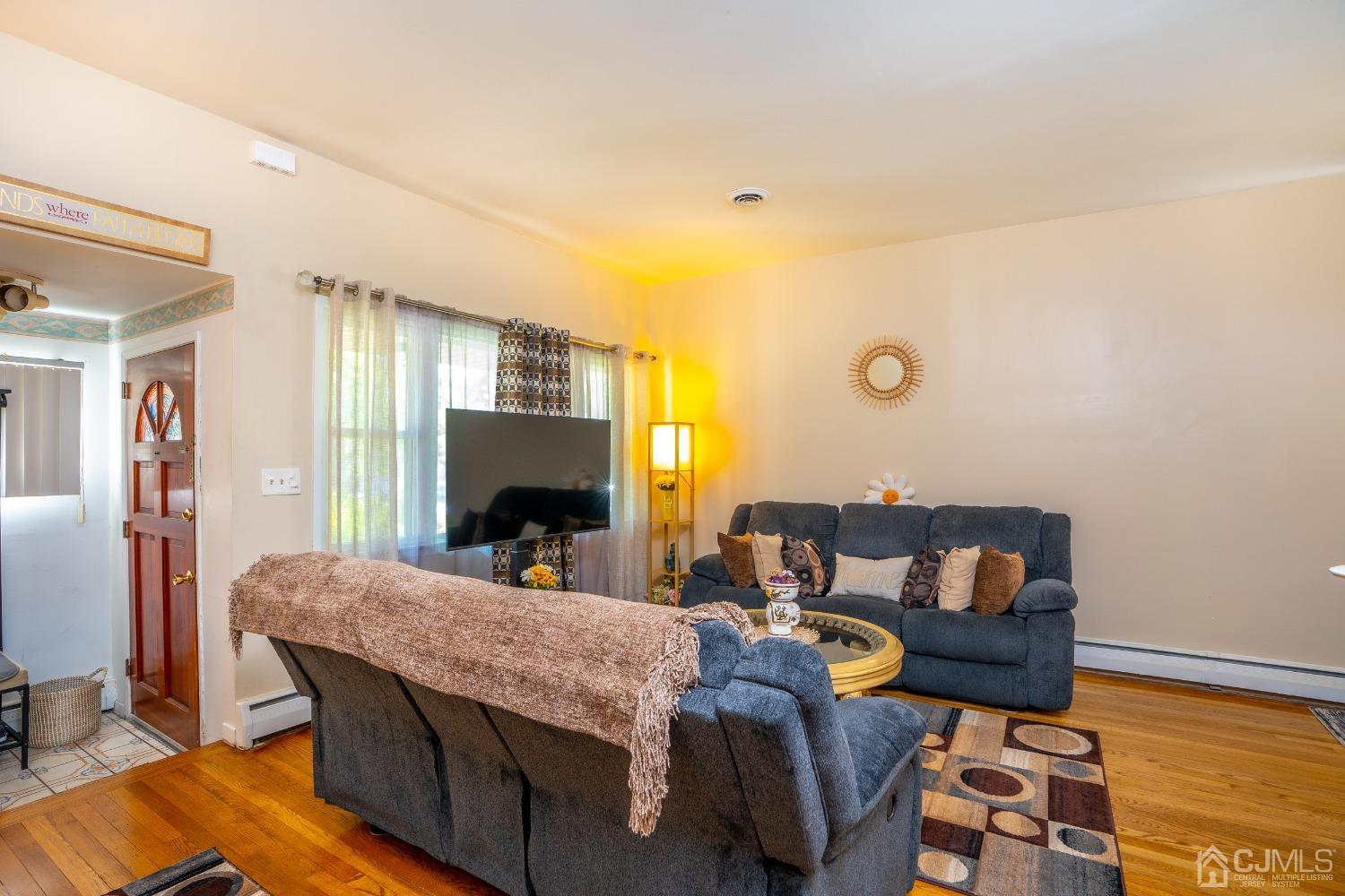 11 Exeter Road Fords, NJ 08863 - Photo 6 of 29 a living room with furniture and a fireplace