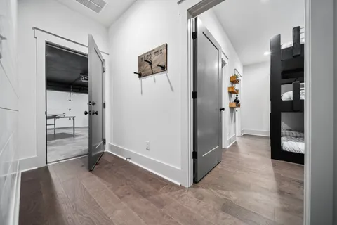 a view of a livingroom with wooden floor and cabinet