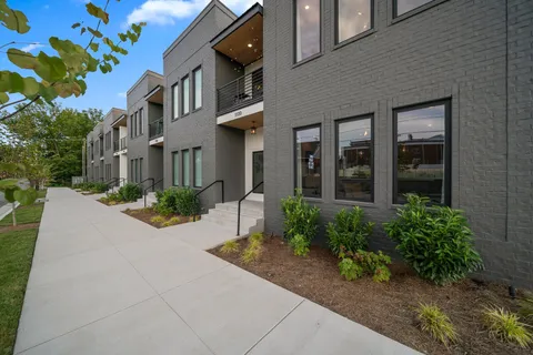 a view of a building with potted plants