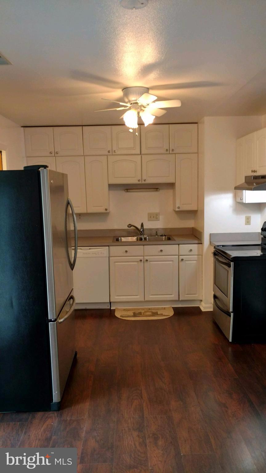 Large kitchen with stainless steel appliances