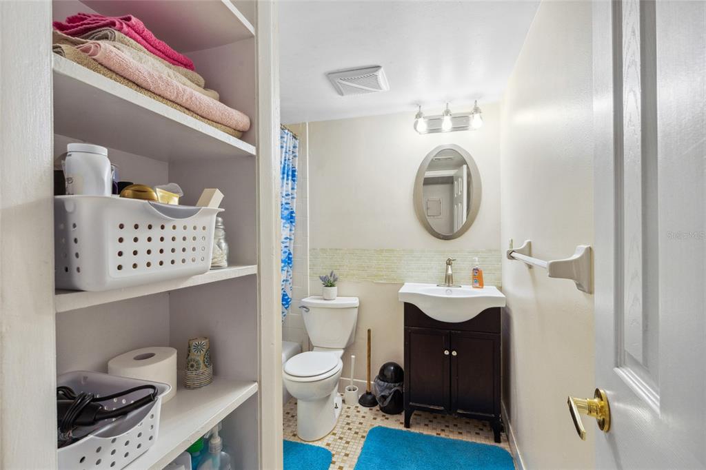 1700 Southwest 16th Court, Unit M2 Gainesville, FL 32608 - Photo 9 of 13 a bathroom with a toilet sink and mirror