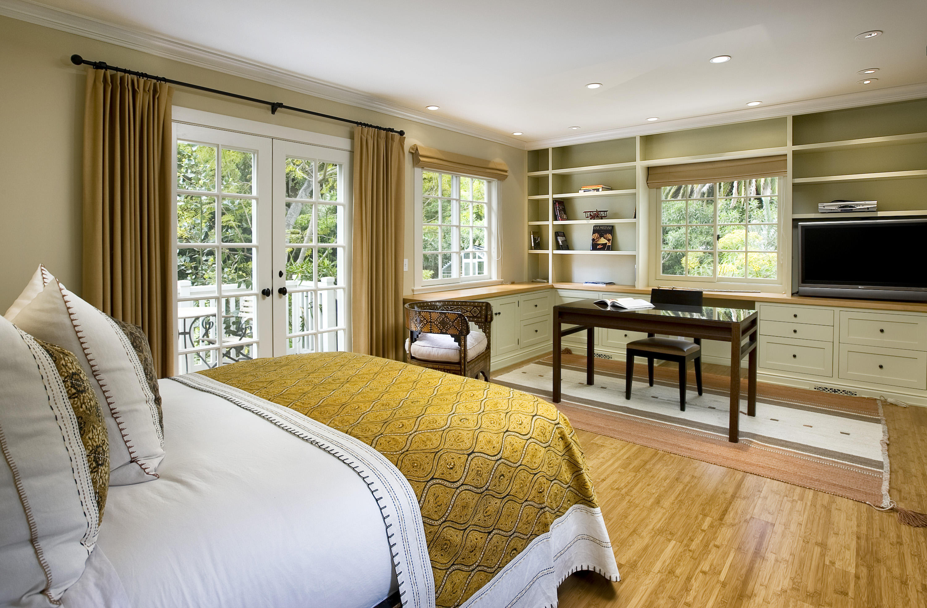 1422 East Valley Road Santa Barbara, CA 93108 - Photo 18 of 25 a bedroom with a bed and a flat tv screen next to a large window