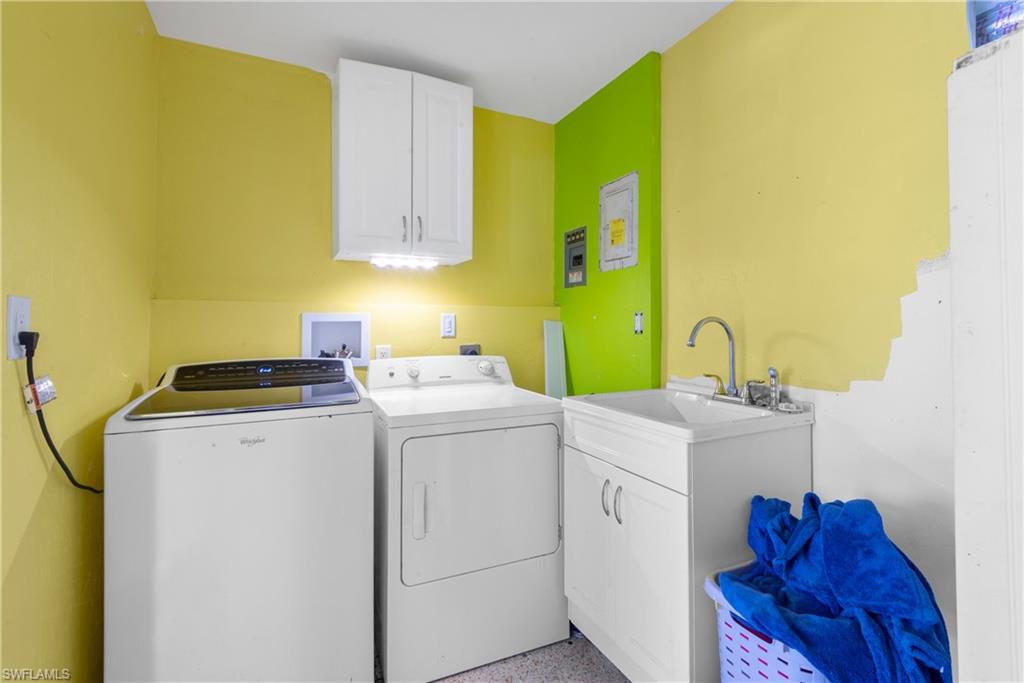19053 Holly Road Fort Myers, FL 33967 - Photo 11 of 21 a utility room with dryer and washer