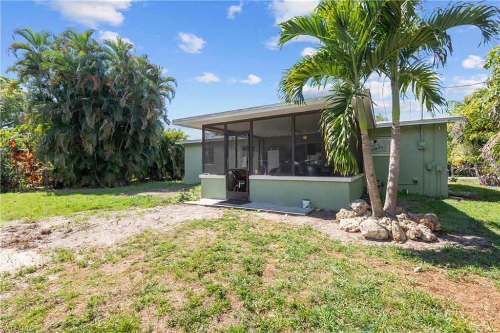 19053 Holly Road Fort Myers, FL 33967 - Photo 16 of 21 a front view of a house with garden