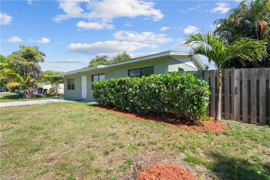 19053 Holly Road Fort Myers, FL 33967 - Photo 19 of 21 a front view of house with yard and green space