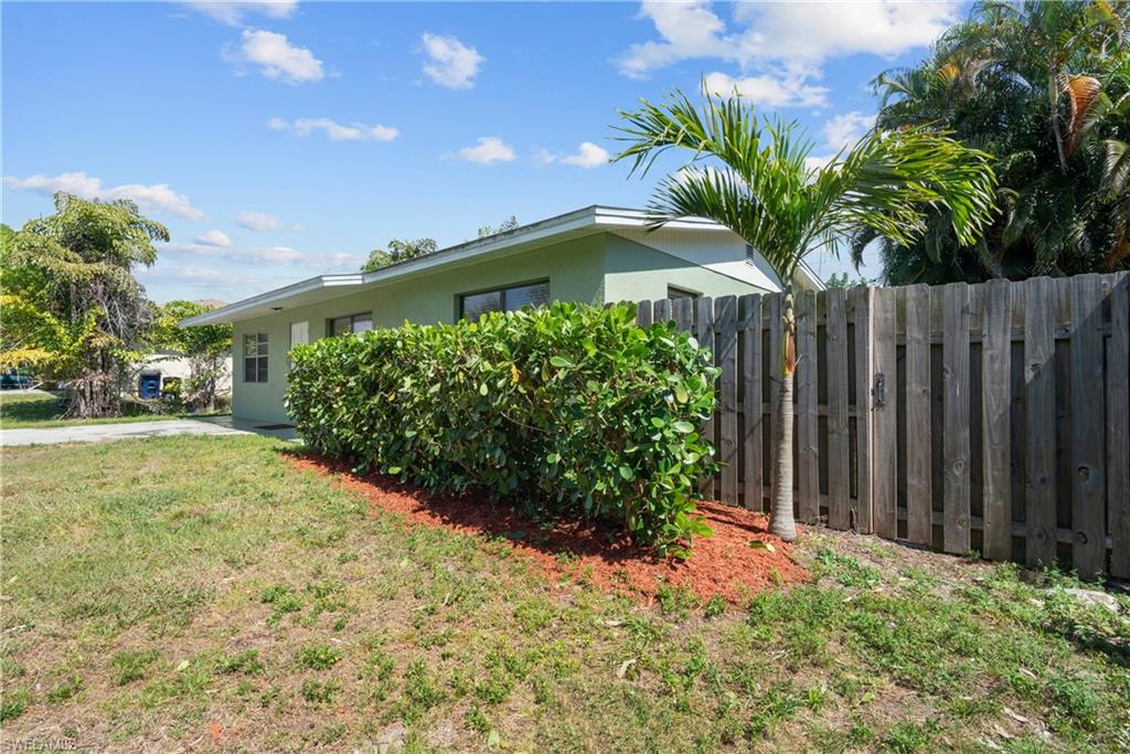 19053 Holly Road Fort Myers, FL 33967 - Photo 20 of 21 a front view of house with yard and trees