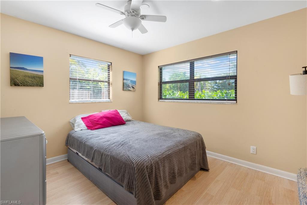 19053 Holly Road Fort Myers, FL 33967 - Photo 2 of 21 a bedroom with a bed and a window