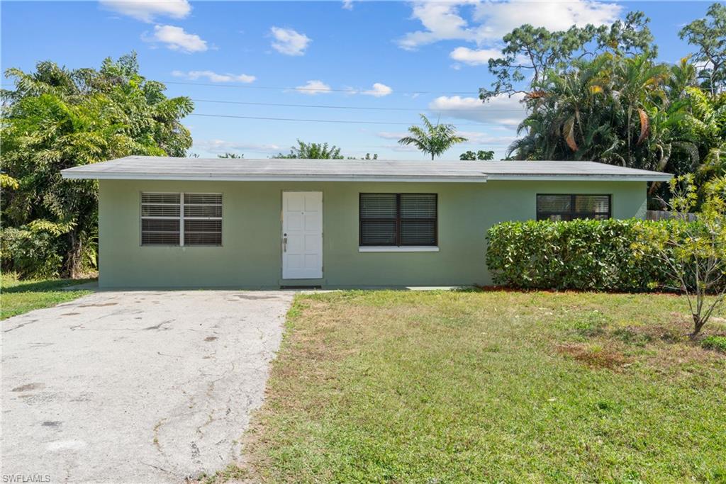 19053 Holly Road Fort Myers, FL 33967 - Photo 21 of 21 front view of a house with a yard