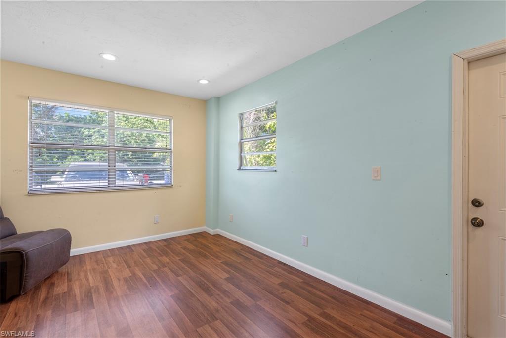 19053 Holly Road Fort Myers, FL 33967 - Photo 3 of 21 a view of room with window and wooden floor