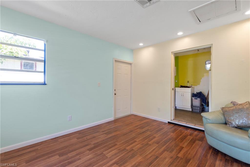 19053 Holly Road Fort Myers, FL 33967 - Photo 4 of 21 a view of livingroom with furniture and wooden floor