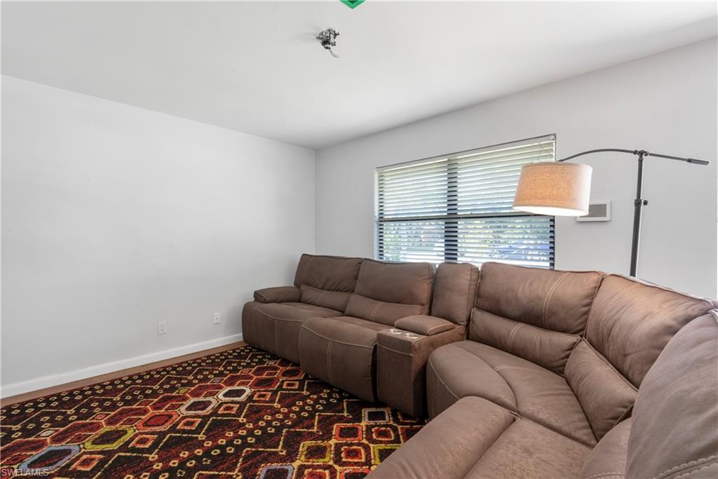 19053 Holly Road Fort Myers, FL 33967 - Photo 6 of 21 a living room with furniture and a window
