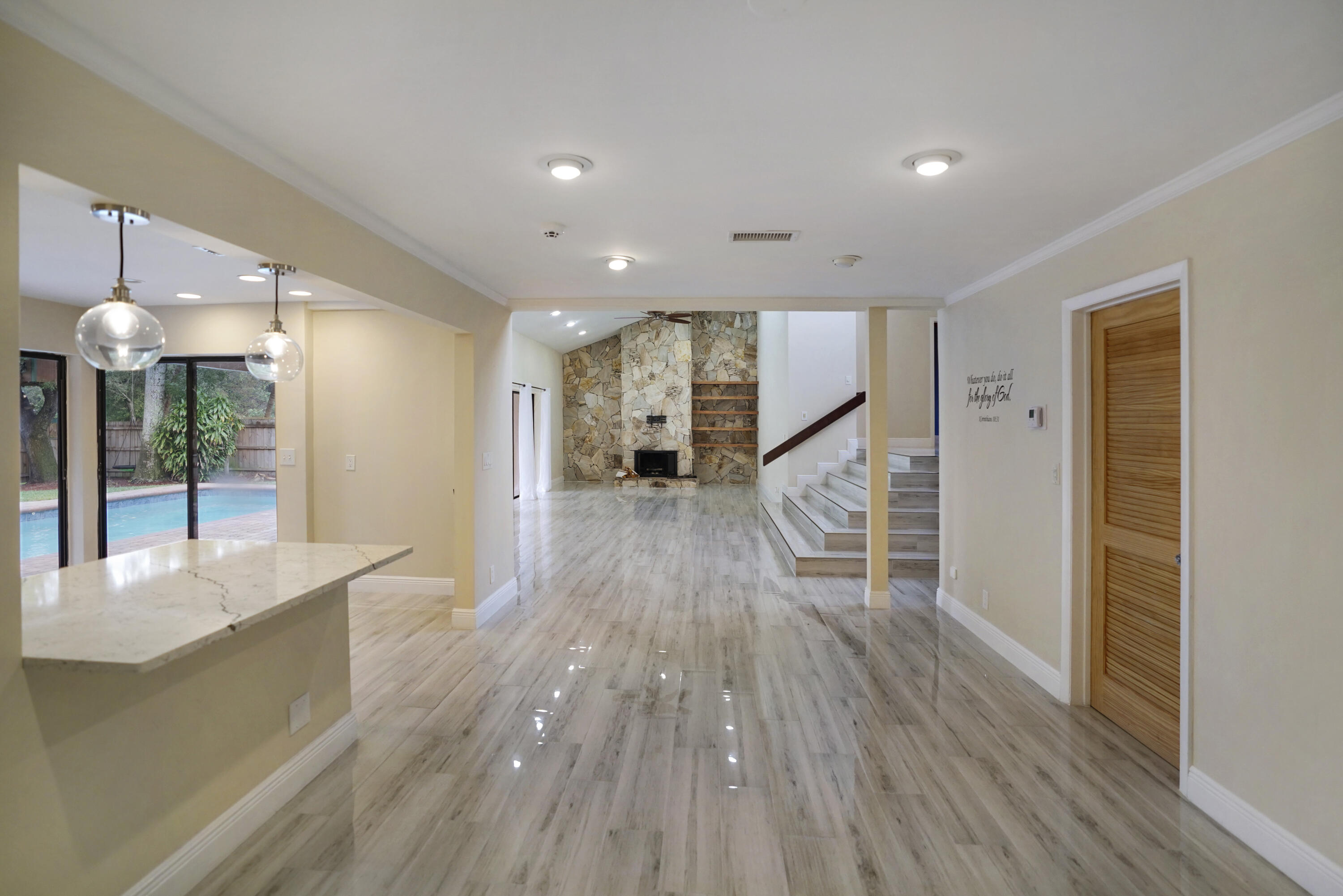 2674 Northwest 41st Street Boca Raton, FL 33434 - Photo 18 of 48 a view of a living room and wooden floor